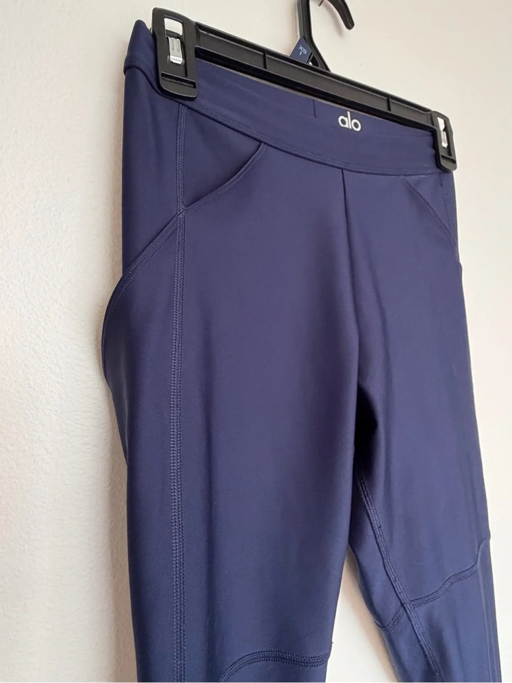 Alo Yoga High-Waist Airlift 4 Pocket Utility Leggings in a dark navy blue color.